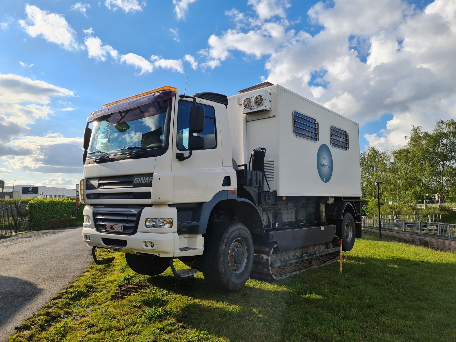 Tracked truck rig equipped for CPTu (cone penetration) testing.