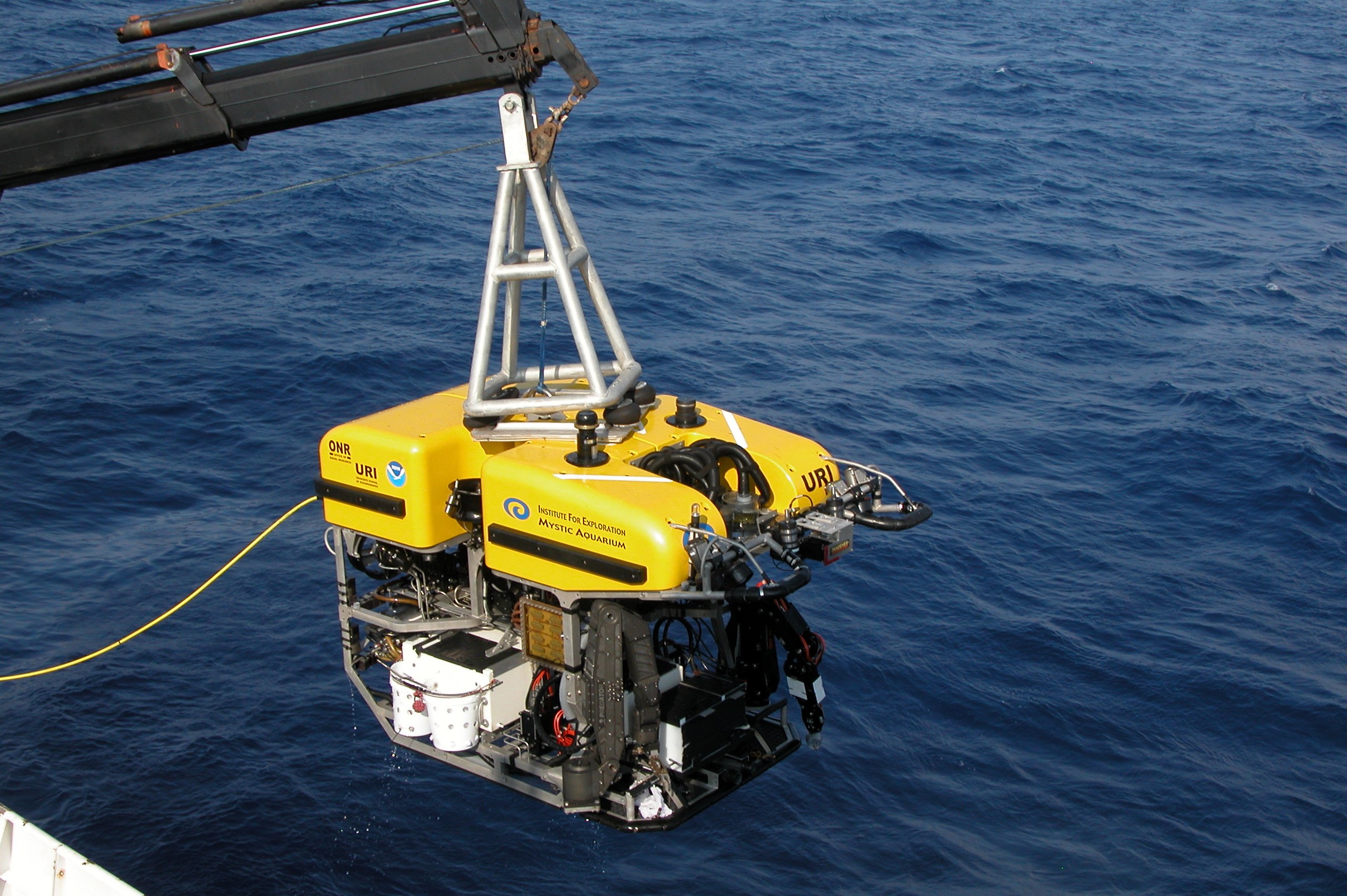 ROV (remotely operated vehicle) being lowered over the water during a geophysical survey